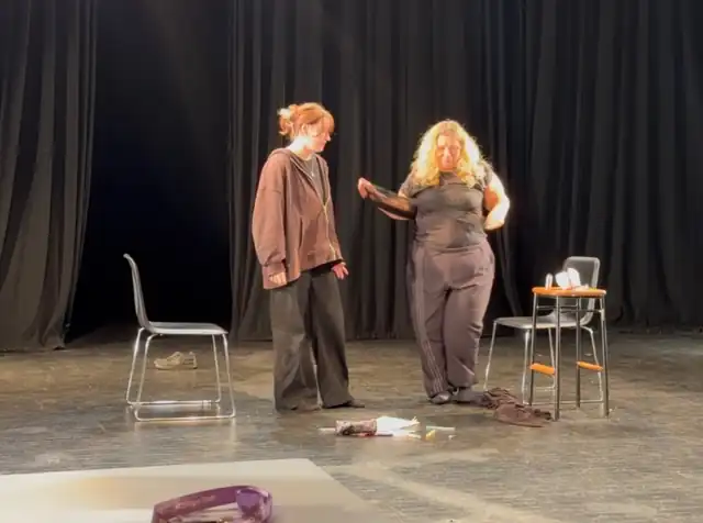 Two performers on stage during The Secret