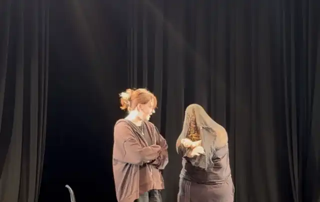 A comic moment with the dress during the performance